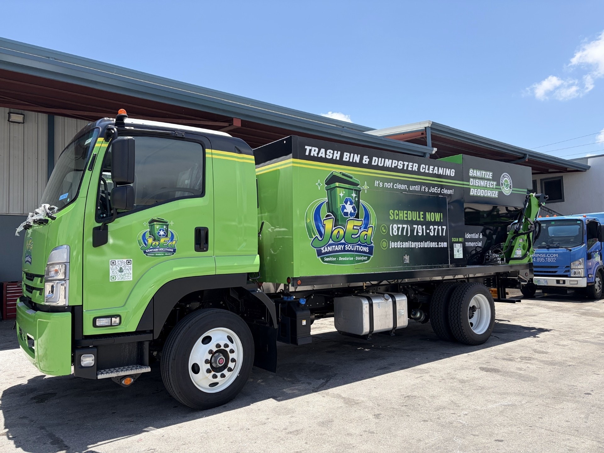 JoEd Sanitary Solutions branded sanitation truck — side view